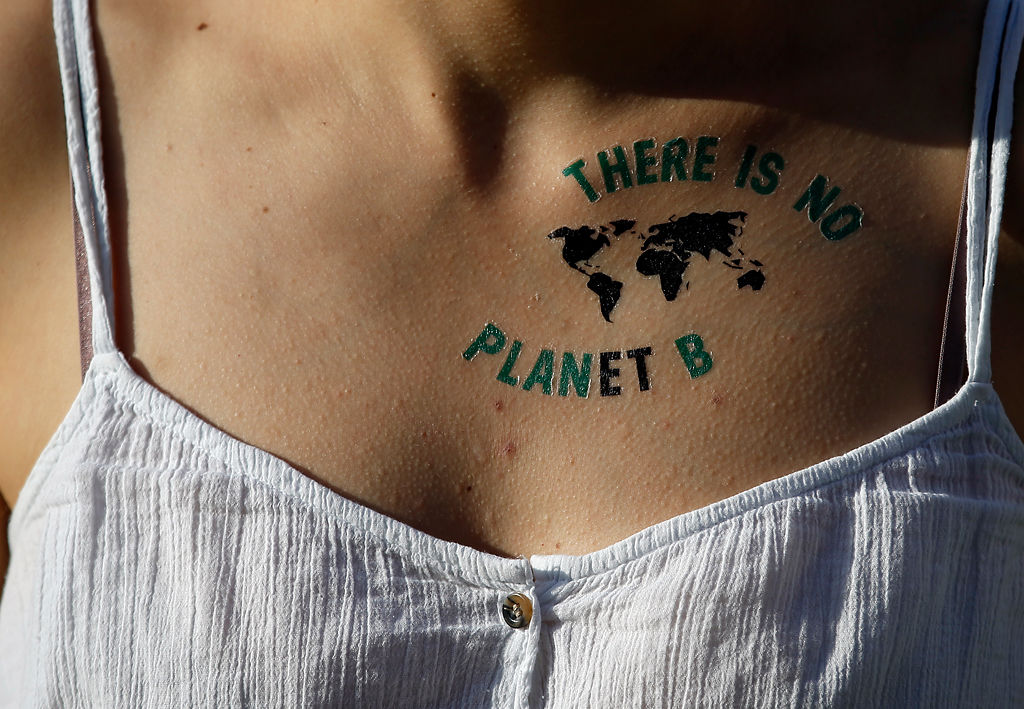 An activist attends a rally as part of the 'Friday For Future' global strike in Belgrade, Serbia
